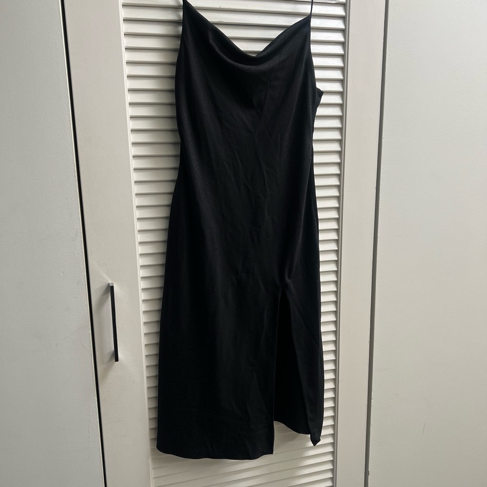 Black dress from urban outfitters with leg cut.